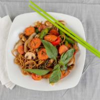 Spicy Spaghetti · Spicy. Vegan. Spaghetti stir-fried with fresh tomatoes, onions, carrots, chili, bell peppers...