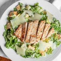 Chicken Caesar Salad · Romaine lettuce with fresh parmesan and tossed in our caesar dressing. Topped with homemade ...