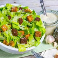Caesar Salad With Chicken · Romaine heart lettuce with seasoned croutons and chicken breast.