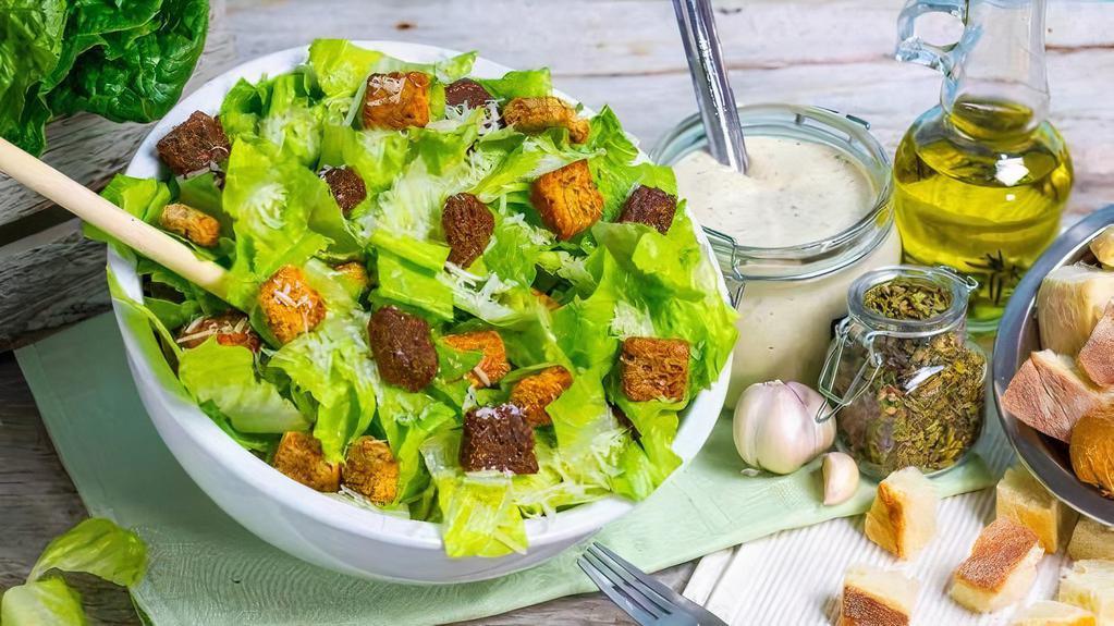 Caesar Salad With Chicken · Romaine heart lettuce with seasoned croutons and chicken breast.