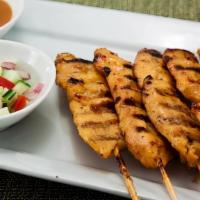 Satay · Grilled marinated chicken or beef skewers, peanut curry dipping sauce, and cucumber relish.