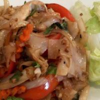 Drunken Noodle · Spicy basil garlic sauce, flat rice noodle, bell peppers, tomatoes, sweet onion, and Thai ba...