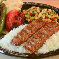 Beef Luleh Kebab · Marinated ground beef. Served with basmati rice, grilled tomato and jalapeño, pita bread, an...