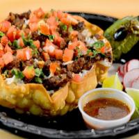 Rice Bowl · Tortilla shell filled with refried beans, basmati rice, your choice of meat, pico de gallo, ...
