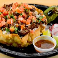 Veggie Rice Bowl · Tortilla shell filled with refried beans, basmati rice, veggies, pico de gallo, topped with ...