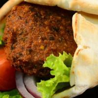 Falafel Sandwich · Served with hummus, lettuce, tomato, and red onion wrapped in pita bread.