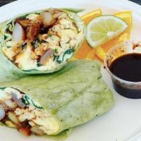 Breakfast Burrito · Spinach Wrap filled with organic eggs, potatoes, onion, spinach and vegan bacon bits with a ...
