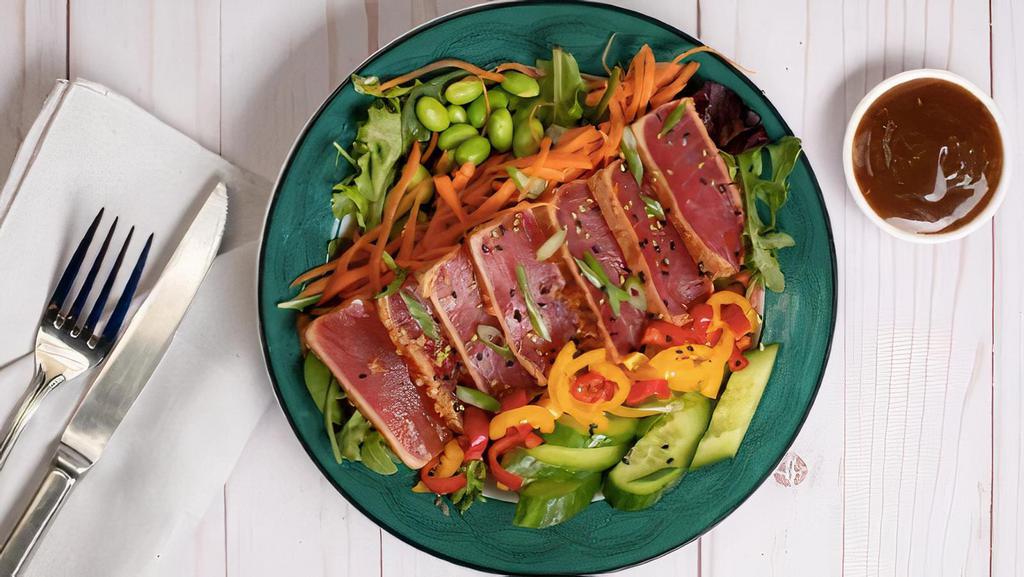 Seared Ahi Tuna Salad · Mixed greens with arugula, seared ahi tuna, shallots, cucumber, edamame, carrots, baby bell peppers, sesame vinaigrette on the side (3 oz)