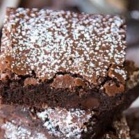 Triple Chocolate Brownie  · Large chocolate brownie served warm, finished with powdered sugar!