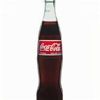 Mexican Coke · Mexican Coke-Made with pure cane sugar, no high fructose corn syrup, in a glass bottle.  355...
