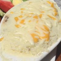 Shepard'S Pie · Seasoned ground beef mixed with peas and carrots, topped with homemade mashed potatoes and s...