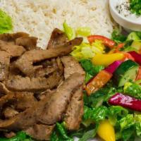 Gyro Plate · Marinated lamb and beets served with tzatziki, salad, rice, and pita bread.