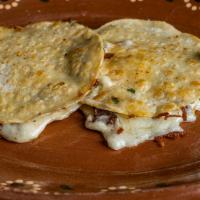 Mulitas · Double corn tortilla, cheese, choice of meat, onions, cilantro, salsa (1 mulita)