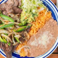 Carne Asada Plate · Comes with grilled onions and jalapenos. Rice , Beans and corn tortillas included.