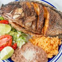 Fried Mojarra Plate · Deep fried whole tilapia fish, rice and beans on the side.