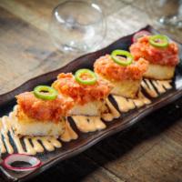 Spicy Tuna On Crispy Rice Cake · Rice cakes topped with spicy tuna.