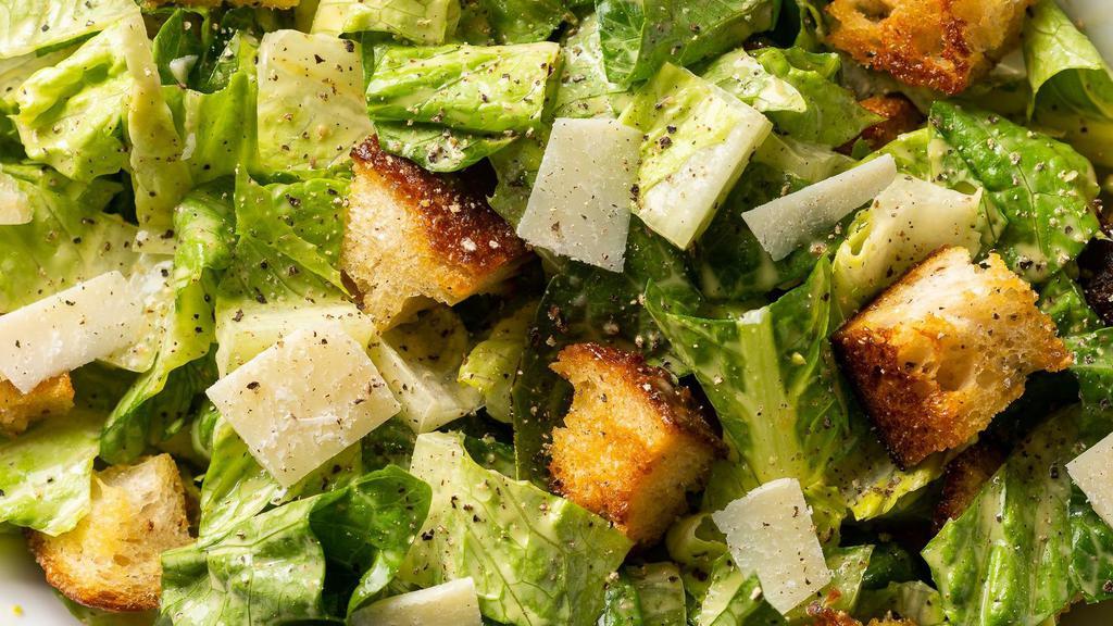 Caesar Salad · Romaine lettuce, croutons, shredded parmesan cheese, and Caesar dressing.