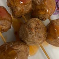 Meatball Skewers  · Fried beef meat ball skewers side of sweet sour sauce