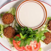 Falafel Plate · Ground fava beans, chic peas, vegetables and spices deep fried.