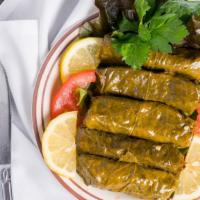 Grape Leaves · Grape leaves stuffed with rice, tomatoes and cooked in lemon juice.