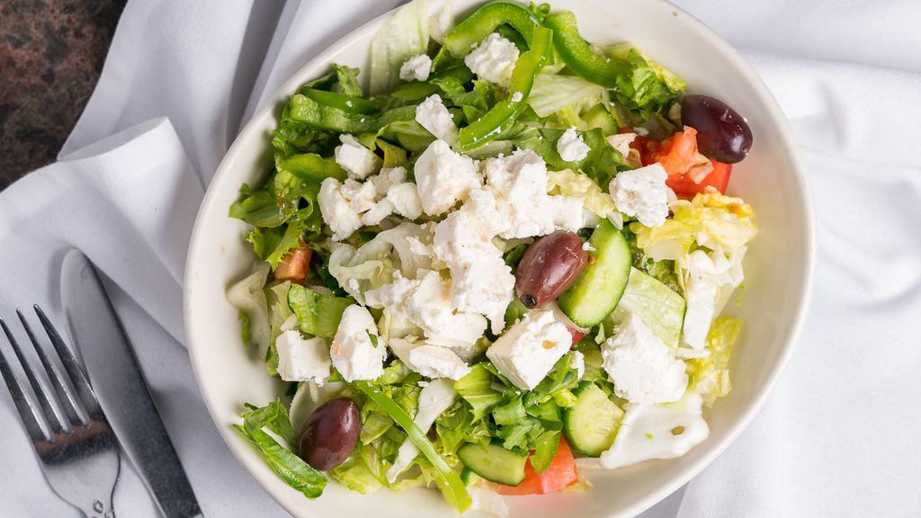 Greek Salad · With fresh lettuce, ripe tomatoes, bell peppers, cucumber. Feta cheese and Greek olives.