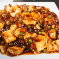 Ma Po Tofu · Steamed tofu, peas, carrots, mushrooms, in sweet spicy sauce.  Served with white rice. Veget...