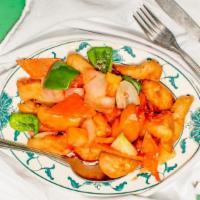 Sweet And Sour Chicken · Chunks of chicken deep fried in batter, then mixed with vegetables sauteed in sweet and sour...