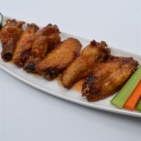 Jumbo Asian Sweet Chili Wings · Jumbo wings marinated overnight, slow cooked, then deep fried golden brown and tossed in Asi...