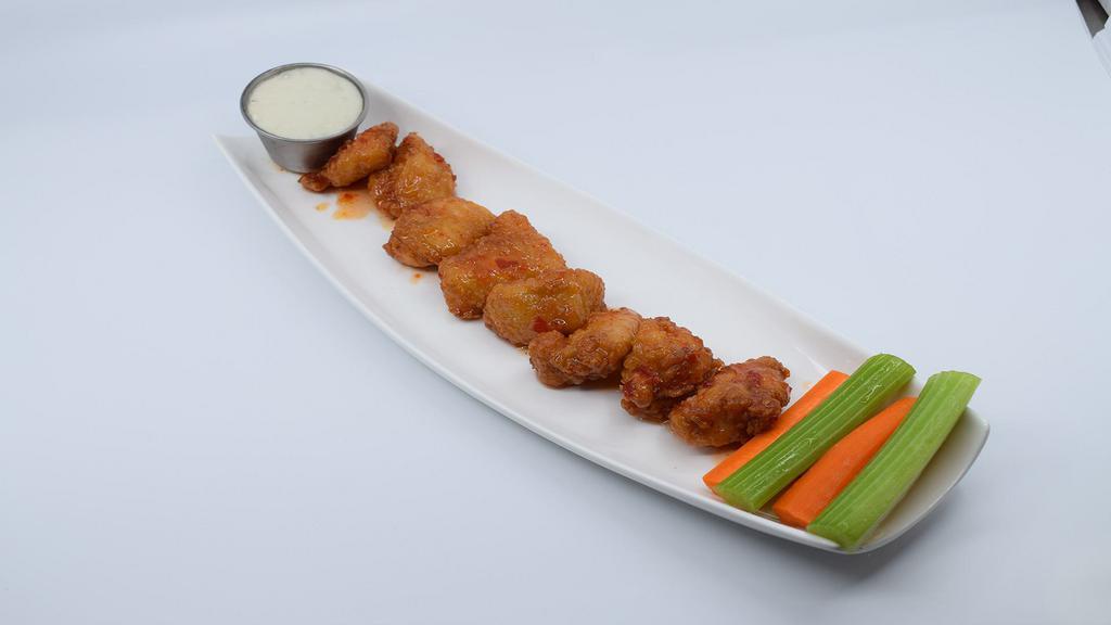 Boneless Asian Sweet Chili Wings · Boneless wings deep fried golden brown and tossed in Asian Sweet Chili Sauce. Served with crisp celery and carrot sticks.