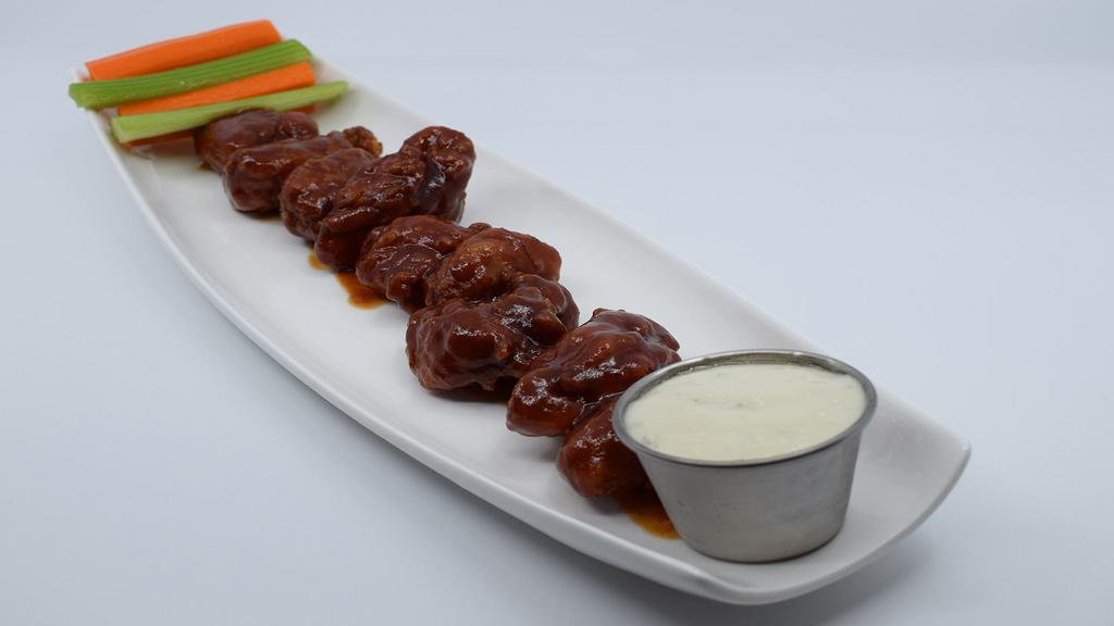 Boneless Kansas City Classic Bbq Wings · Boneless wings deep fried golden brown and tossed in Kansas City Classic BBQ Sauce. Served with crisp celery and carrot sticks.