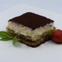 Tiramisu · The classic Italian dessert. A layer of creamy custard set atop espresso-soaked ladyfingers.