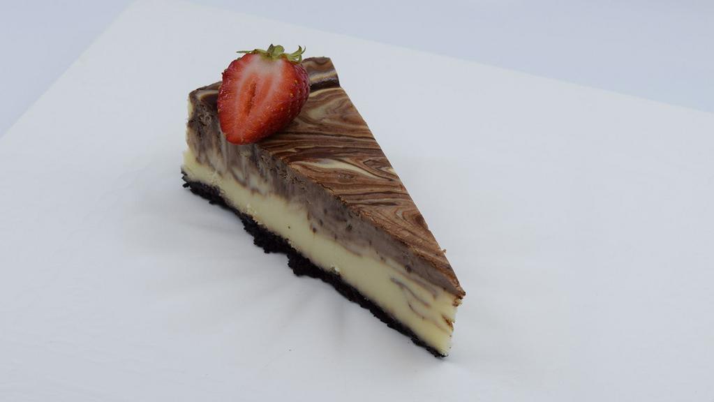 Chocolate Cheesecake · A rich classic decadent blend of smooth chocolate cheesecake and fluffy Belgian chocolate mousse in a chocolate crust.