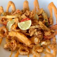 Fried Calamari · Citrus ‘buffalo’ sauce, tempura peppers and onions.