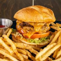 Tasty Burger · Double patty smashed burger, shredded lettuce, tomato, cheddar cheese, secret sauce, caramel...