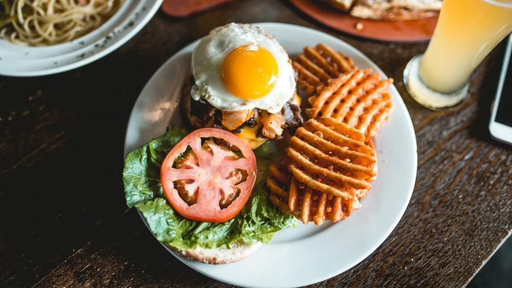 Ktpc Burger · Home-made beef patty, bulgogi, fried kimchi, American cheese, tomato, hearts of romaine, fried egg and house sauce, with a side of waffle fries.