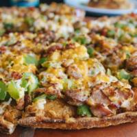 Morning Glory / Breakfast Pizzza · Scrambled eggs, bacon, sausage, ham, cheese, bell peppers, layered hashbrown, hashbrown crust.