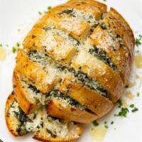 House Stuffed Bread  · Garlic white wine butter, parmesan cheese, parsley