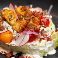 Iceberg Blt Wedge Salad · Red wine and creamy blue cheese dressings, warm parmesan croutons, crisp bacon, shaved onion...