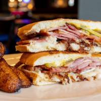 Media Noche · Cuban sandwich with our on twist made with ham, pork, cheese, tomatoes, pickles, mustard and...