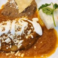 Chile Relleno De Queso · Roasted poblano pepper stuffed with queso fresco, dipped in egg batter then fried and topped...