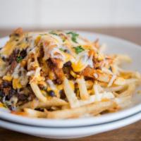 Chili Cheese Fries · Crispy fries loaded with slow simmered house made chili covered in cheese.