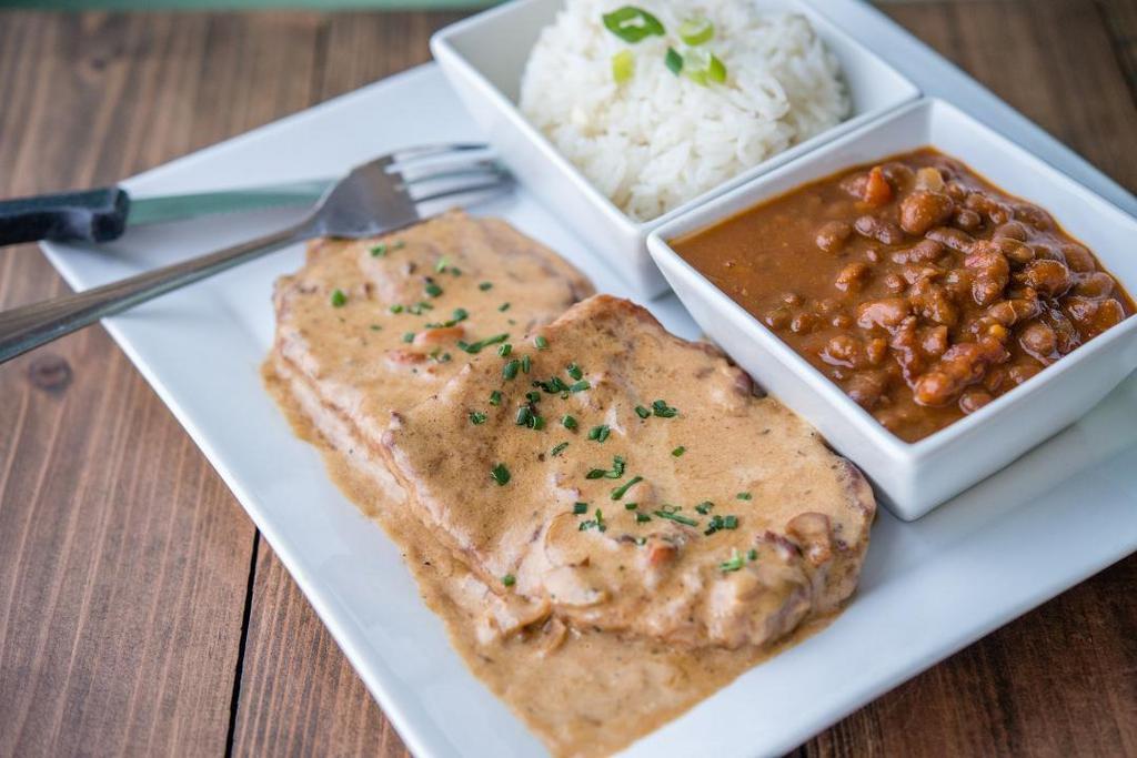 Smothered Pork Chops · Hand tossed and seasoned, pan fried, covered in bacon gravy