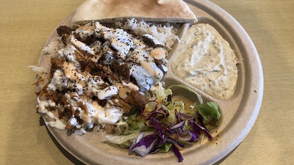 Vegetarian Combo Plate · Tasty falafel and fresh dolmah with rice, salad, pita bread, plus your choice of hummus.