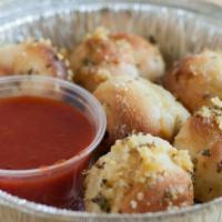 Garlic Knots · Delicious knots dipped in our secret garlic sauce.