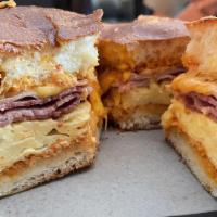 Breakfast Sandwich · Soft scrambled eggs, ham, cheddar cheese, chipotle mayo, toasted buttered brioche.