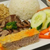 Charbroiled Beef, Shredded Pork, & Meatloaf Plate  (Cơm Bi Cha Bo) · Charbroiled beef, shredded pork, and meatloaf with a side of rice & vinaigrette.