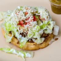 Sopes · Includes beans, choice of meat, sour cream, guacamole, lettuce, tomato, and monterey jack