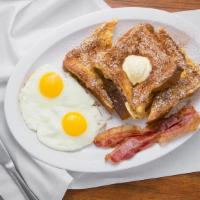 French Toast (2) · With two eggs and either two pieces of bacon or two pieces of sausage.