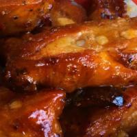 Bbq Rib Tips  · One pound of smoky all natural tender bone in ribs tossed in barbecue sauce.