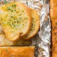 Garlic Bread · French bread sliced into eight pieces baked with garlic butter and herbs. Served with a side...